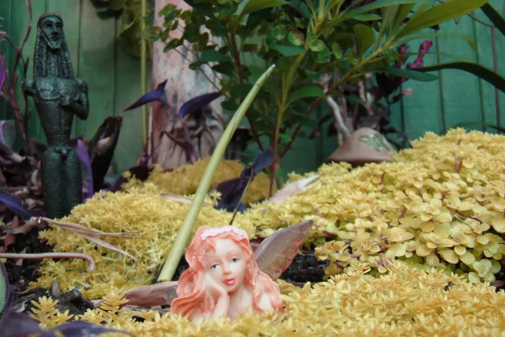 a historical fairy amidst a lush garden.